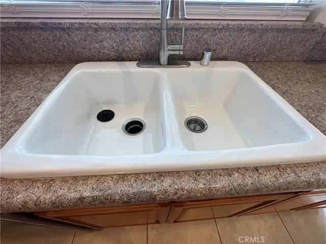 Reglazed sinks with new faucets