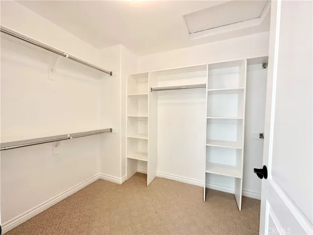 Large walk-in closet with closet organizers