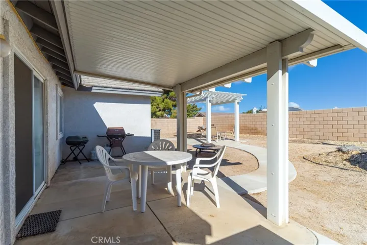 Another view of patio area with patio cover