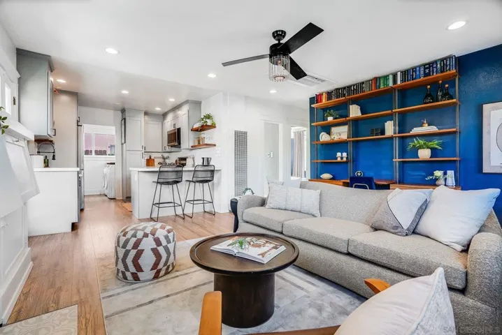 Open living room overlooking large completely renovated kitchen