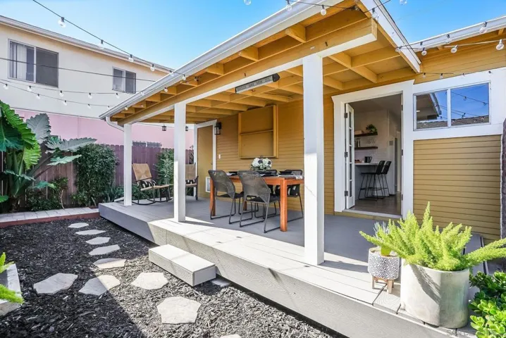 Oversized Trex deck for outdoor dining and entertaining! Beautiful landscaping! Cafe lights will convey with sale.