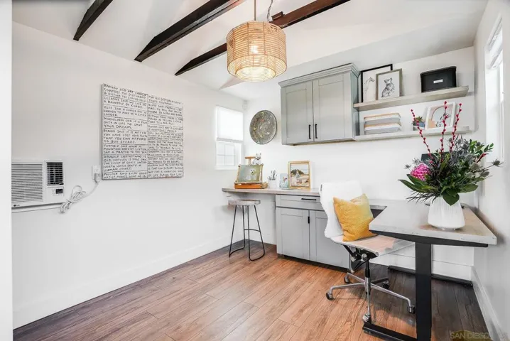 Part of garage converted to beautiful and functional home office / art studio with A/C! Tons of extra storage too.