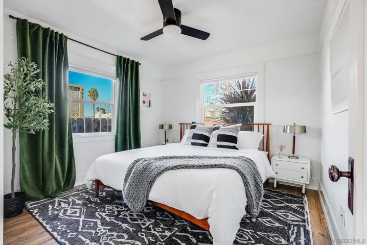 Light & bright primary bedroom with King-sized bed and closet with beautiful barn doors.