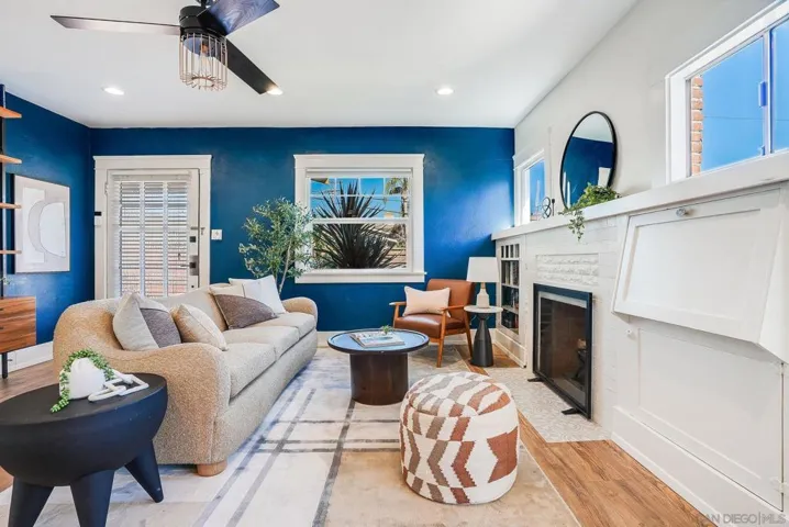 Open living room with some 1924 charm and a fully functional wood-burning fireplace