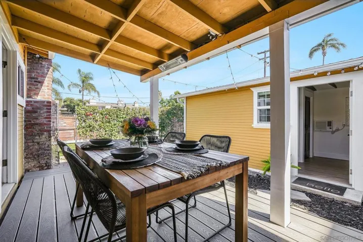 Oversized Trex deck for outdoor dining and entertaining! Beautiful landscaping! Cafe lights will convey with sale.