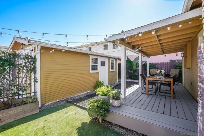 Oversized Trex deck for outdoor dining and entertaining! Beautiful landscaping! Cafe lights will convey with sale.