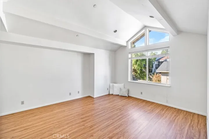 Light, bright bedroom with vaulted ceilings