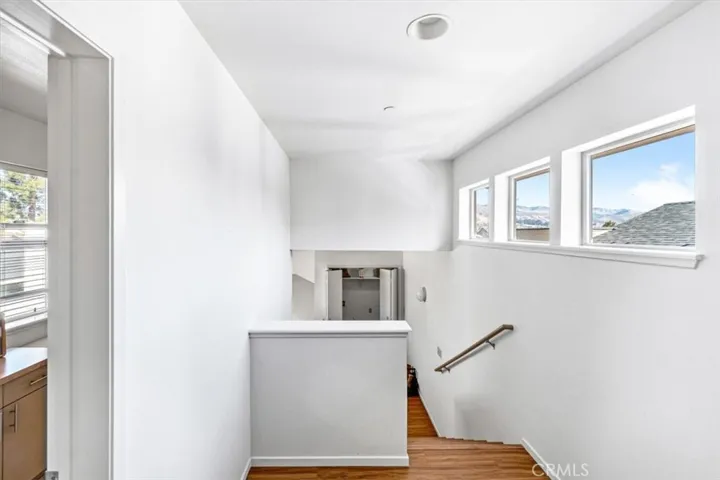 Stairway to upstairs bathroom and bedroom and peekaboo views of the mountains