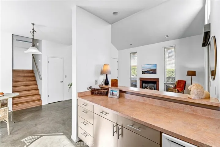 Open concept living area with stairway to the bedroom and bathrooms