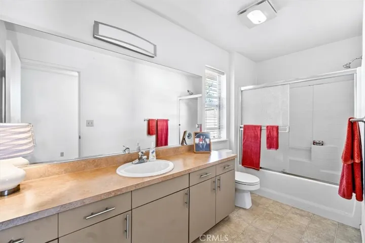 Spacious upstairs bathroom with great lighting and ample storage and counter space - next to the Bedroom on 3rd Level