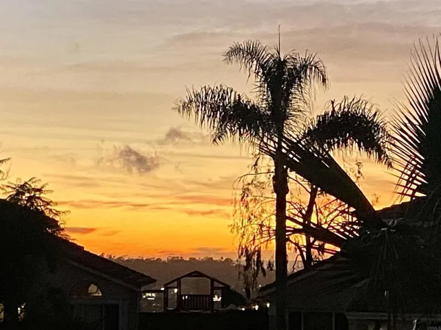 Seller photo-Gorgeous sunset view from the side deck!! Peek a boo of the ocean :)