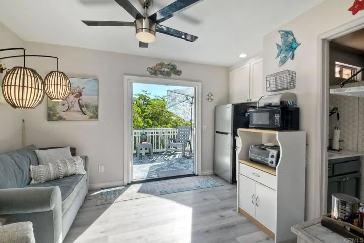 This is the bedroom w/ a private entrance thru French doors. Up the side stairs to this lovely deck!