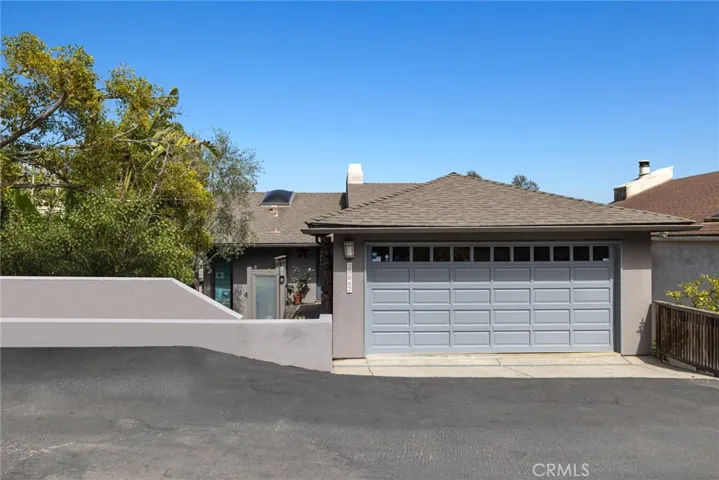 The spacious floorplan measures approximately 2,643 square feet and is complemented by an attached two-car garage and quintessential Californian architecture.