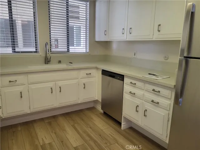 Raised Counter Tops, New Dishwasher and Refrigerator.