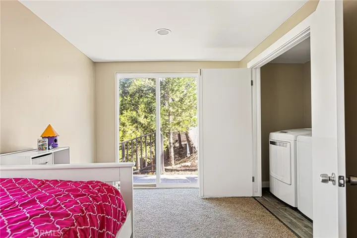 Bedroom #4 with Laundry room, Sliding doors to side yard