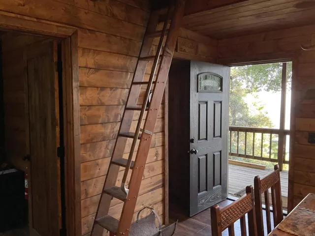 Ladder takes you to huge loft with four twin beds and comfy carpet to sleep lots of kids.