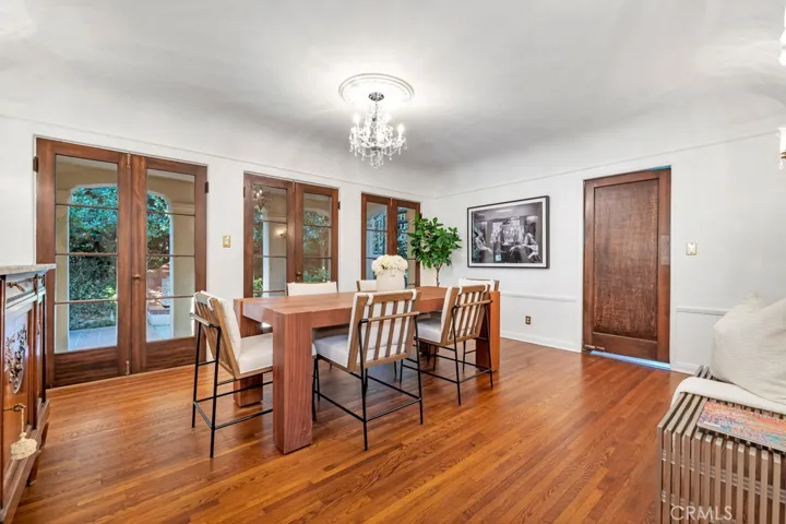 Formal dining room from entry. Left archway next to staircase.