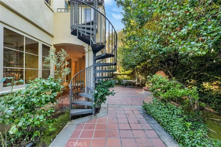 Fountain patio walkway from pool. Outdoor staircase form bedroom 2 sunroom.