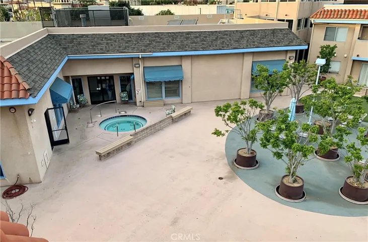 View from roof deck down to hot tub and clubhouse.
