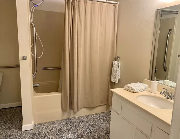 Bathroom with shower over tub.