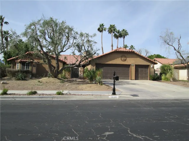olive trees in front. corner lot