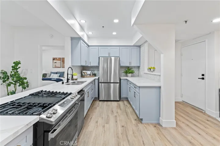 Redesigned kitchen with soft close Cabinets and Quartz