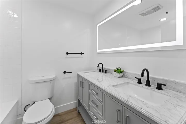 Custom vanity w/ double sink and LED mirror
