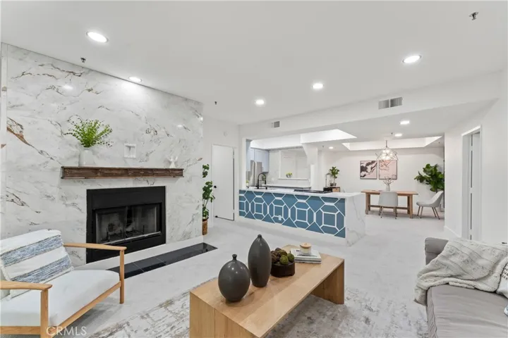 Floor to ceiling tile on fireplace w/ custom mantle