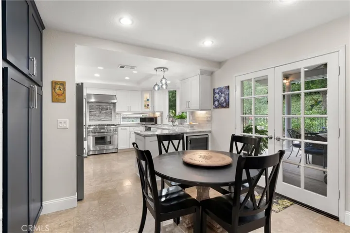 The kitchen was upgraded 2 years ago with custom cabinets, quart counters, stainless steel appliances and limestone flooring.