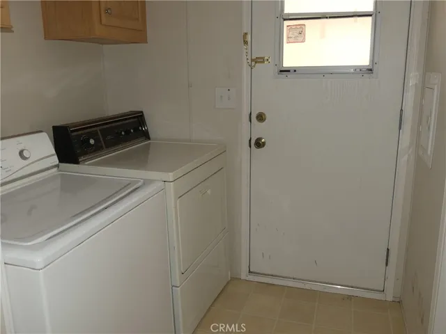Laundry Room with access to the Carport