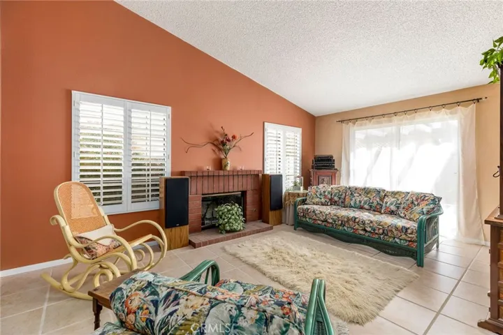 Lovely Wood Burning Fireplace in Living Room - Slider to Patio Area