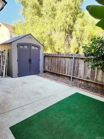 Spacious shed provides additional storage space.