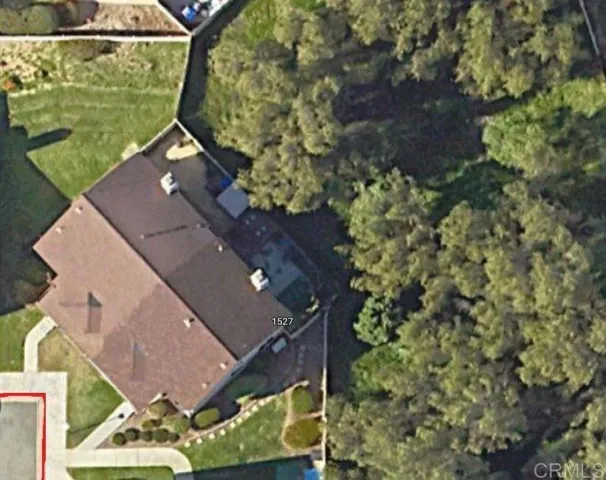 Home is backed with green woodsy area, no neighbors directly behind.
