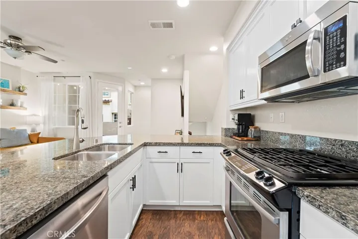 Granite Counter tops & recently professionally painted white  cabinets
