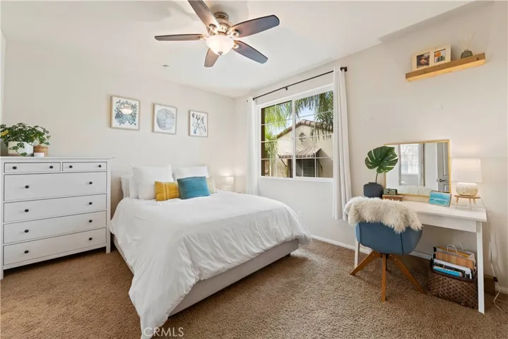 The Primary bedroom is spacious and has high ceilings.