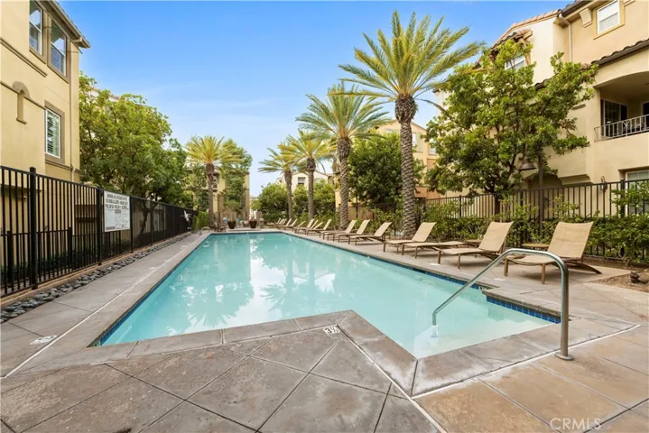 Community swimming pool and spa is near this home.