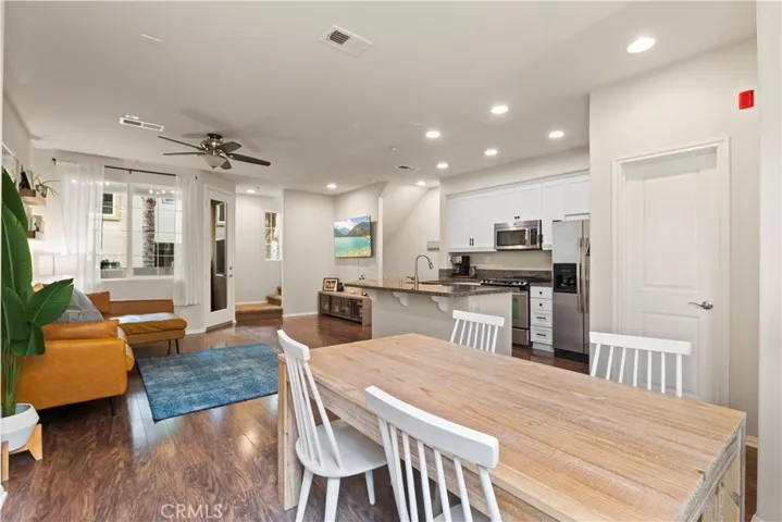 Recessed Lighting and engineered wood like flooring help make this townhouse contemporary.