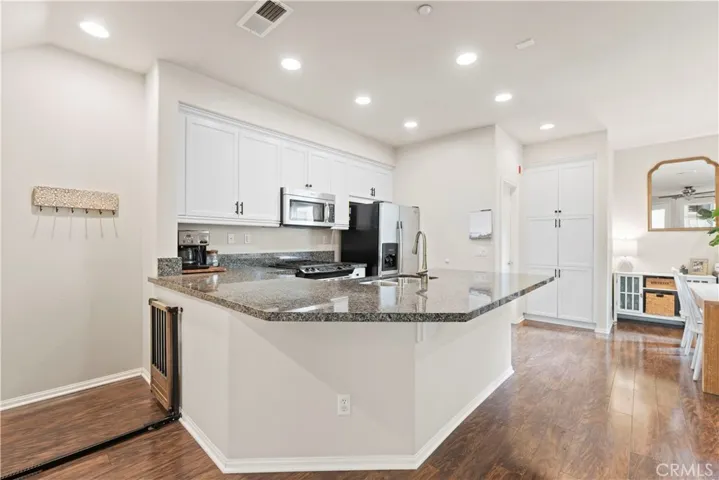 The kitchen counter area can accommodate bar stools too!