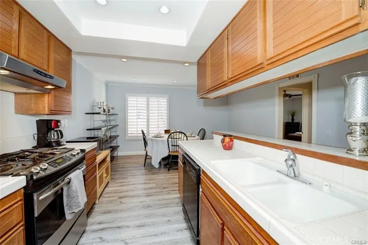 Kitchen with all the appliances including refrigerator.