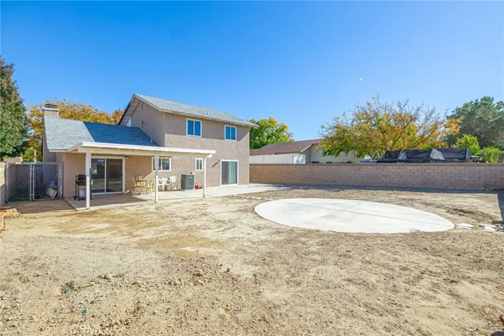 Large rear yard with above ground pad for pool
