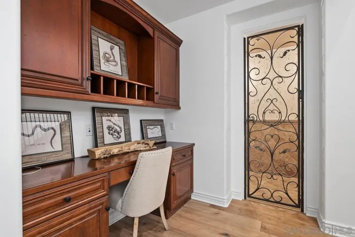 Built in desk, potential wine room entry