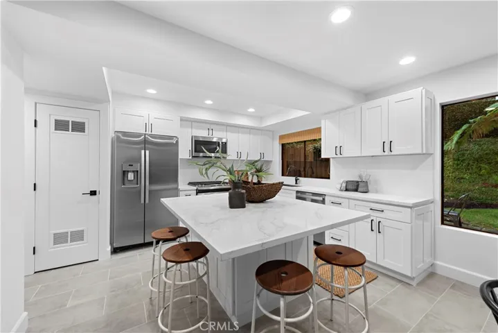 All New Cabinets and Quartz Counter Tops complete this Redesigned Kitchen
