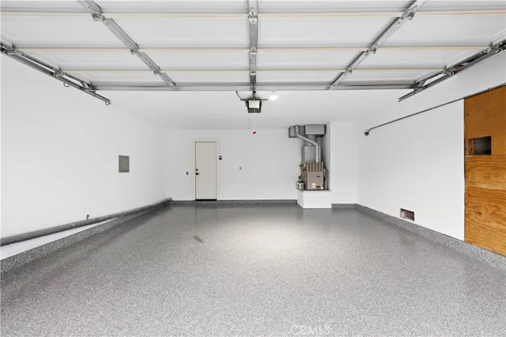 Spacious 2 Car Garage with New Epoxy Floor and New Garage Door