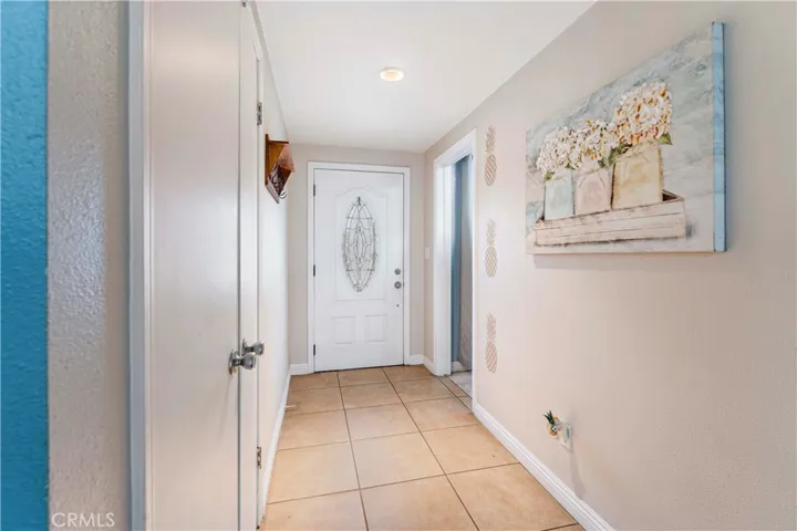 Roomy entry. Once inside, go straight towards the living area or immediately to the right of image (left upon entering) access the galley kitchen with laundry.
