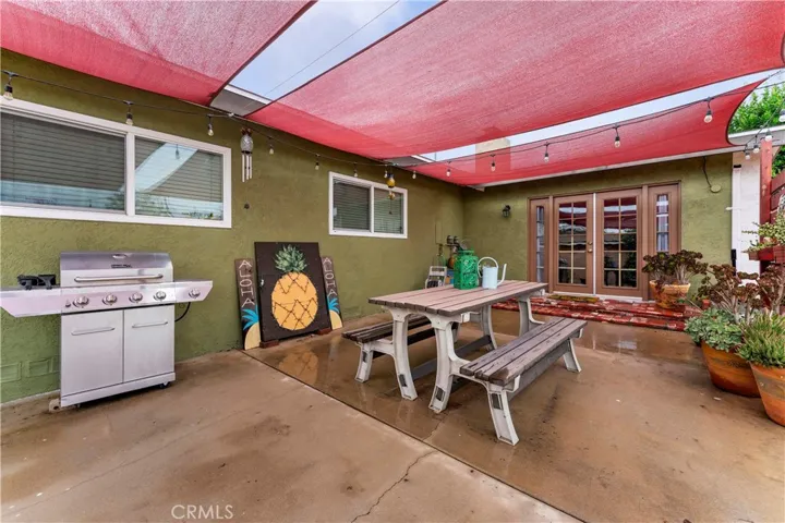 Spacious area to entertain and enjoy. French doors leads to the family room. Windows belong to two of the four bedrooms.