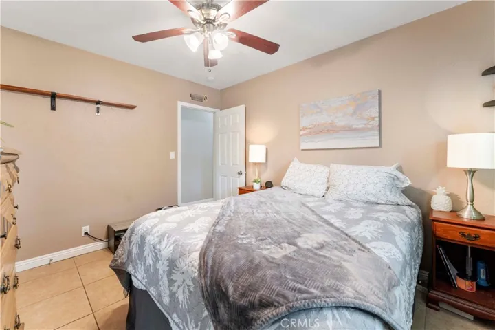 Main bedroom with ceiling fan. Standing from the en-suite.