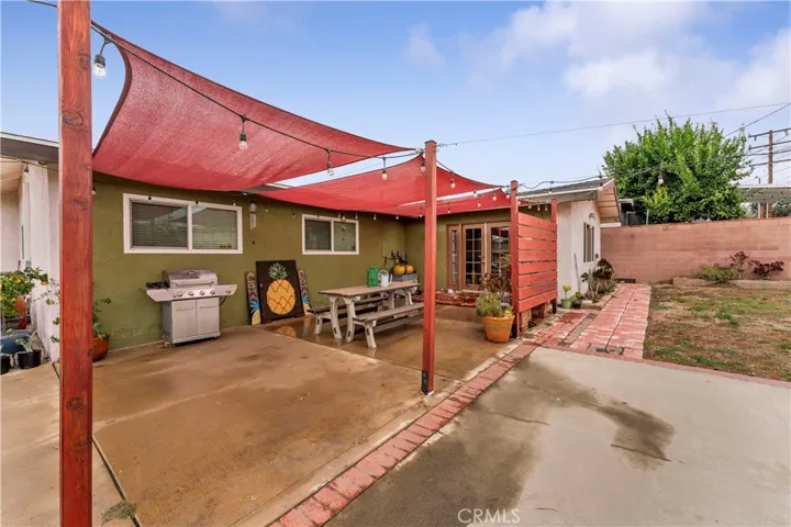 Spacious area to entertain and enjoy. French doors leads to the family room. Windows belong to two of the four bedrooms.