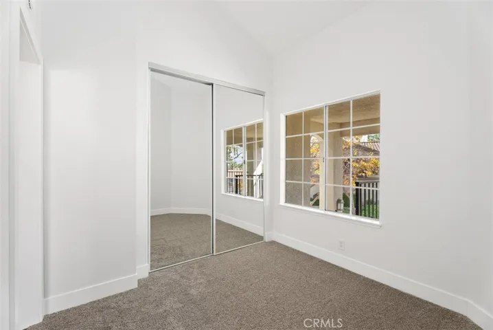 Secondary bedroom has been updated with new carpet, screens and mirrored wardrobe doors