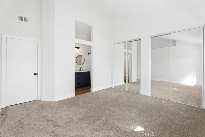 Master bedroom/ bathroom has high ceilings and a lot of natural light