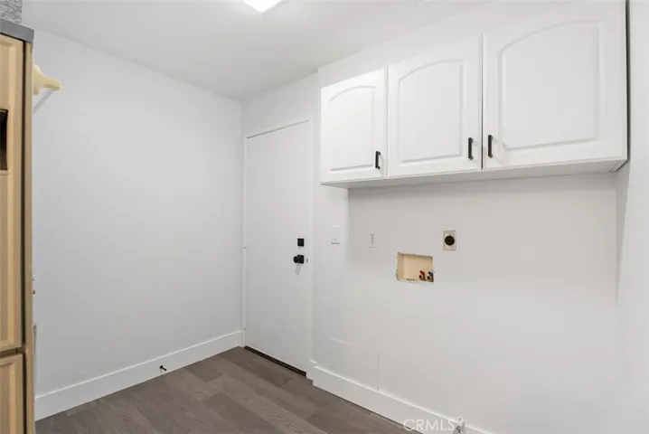Laundry room. Holds Hot water heater, furnace, and has garage access